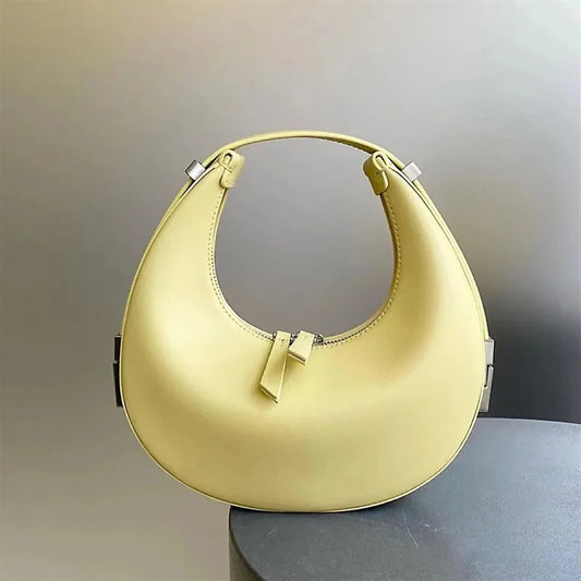 Version coréenne du sac en cuir pour femmes sac croissant cent niche demi-rond sac de lune en peau de vache